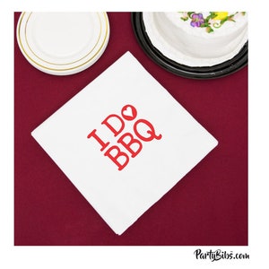 May include: White cloth napkin with red text that says "I  ♥ BBQ".