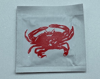 Crab Wet Wipes, stock design crab is printed onto one side of a moist towelette packet for crab feeds, fests & feasts, minimum 25 packets