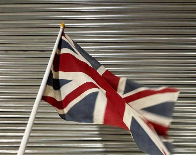 Vintage Union Jack Flag On A White Wooden Pole