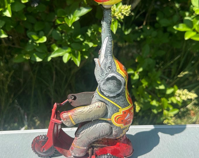 Rare Original Vintage Circa 1940’s Tinplate Mechanical Wind Up Elephant On Scooter balancing a ball