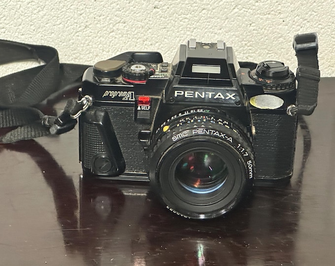 Vintage Pentax Program A Black camera body with 50mm F1.7 A lens