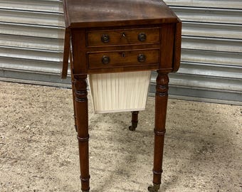 An Attractive 19thC Rectangular Mahogany Drop Side Sewing Table On Brass Castors
