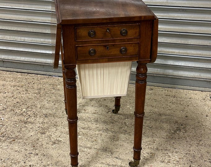 An Attractive 19thC Rectangular Mahogany Drop Side Sewing Table On Brass Castors