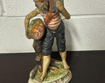 Lovely Circa 1960’s Vintage Italian Ceramic Capodimonte Figurine Of A Fisherman Holding a Fish