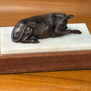Exquisite Vintage Bronze Sculpture Of A Bull / Ox in a resting position on Marble or Onyx And Oak Base