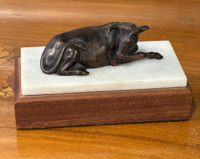 Exquisite Vintage Bronze Sculpture Of A Bull / Ox in a resting position on Marble or Onyx And Oak Base