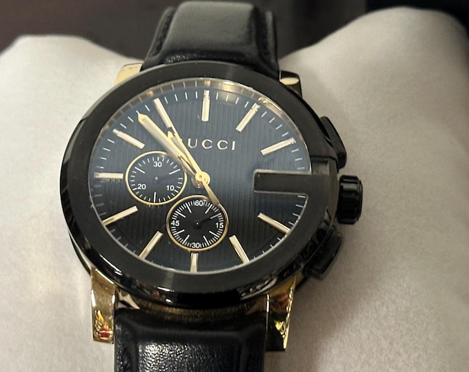 Gucci G-Chrono 44mm Stainless Steel Gold-Plated Case with Black Leather Strap.
