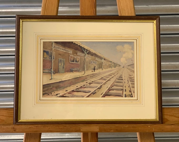 This is a lovely original vintage watercolour titled ‘The Last Train’ signed by the artist lower right with the initials H B