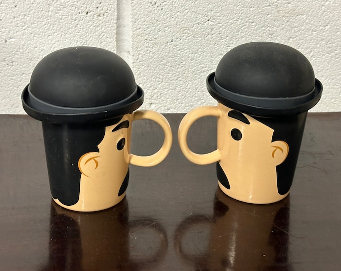 Pair of Balvi Novelty Mugs In Shape Of Man’s Head Wearing A Black Silicone Bowler Hat