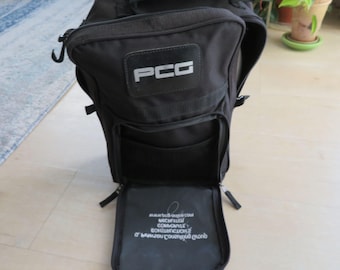 Bolsa para zapatos de golf Seville Gear de lona negra con compartimentos con cremallera y asa acolchada.