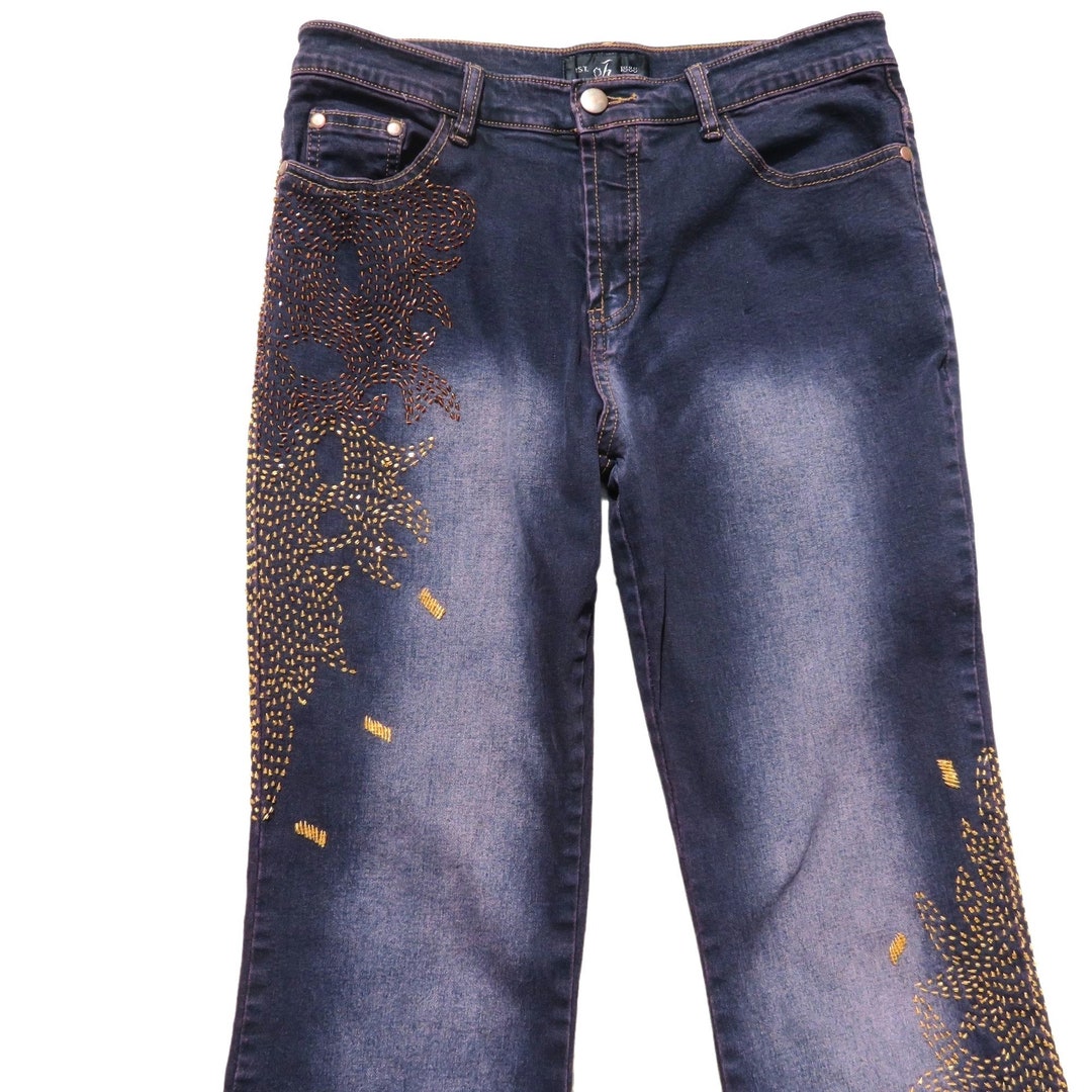 Jeans Vintage Rocker: denim elasticizzato nero con fiamme perline