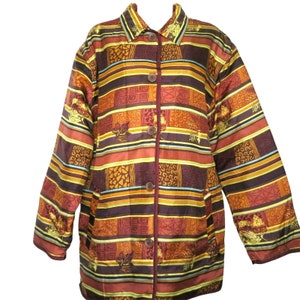 May include: A brown, yellow, and orange patterned jacket with a button-up front. The jacket has a collar and long sleeves.