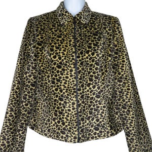 May include: A brown and yellow leopard print jacket with a zipper closure.