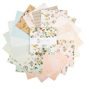 May include: A collection of floral patterned fabric squares in various pastel colors, including pink, blue, and cream. The fabric squares are arranged in a circular pattern, with a central stack of squares labeled "Rose Violette". The fabrics feature floral and script designs.