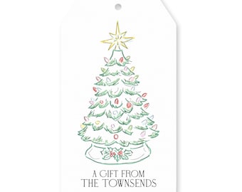 May include: White gift tag with a watercolor illustration of a Christmas tree. The tree is green with colorful ornaments and a gold star on top. The text "A GIFT FROM THE TOWNSENDS" is printed at the bottom.