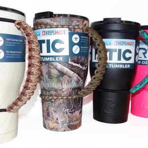 May include: Four different color insulated tumblers with paracord handles. The tumblers are all 30 oz. and have a black lid with a black rubber band around the top. The paracord handles are brown, camouflage, teal, and pink.