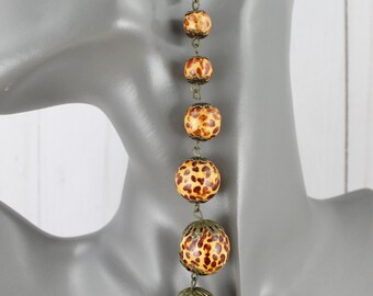 Cheetah print brown wood earrings graduated beads dangle 5.5" long big bead
