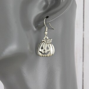 Pumpkin earrings silver carved pumpkin face Halloween earrings 1.25" long Jack O Lantern earrings 1 1/8" long autumn fall earrings
