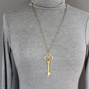 skeleton key necklace 27" long necklace chain skeleton key outline pendant bronze antiqued gold color old fashioned antique look fancy key