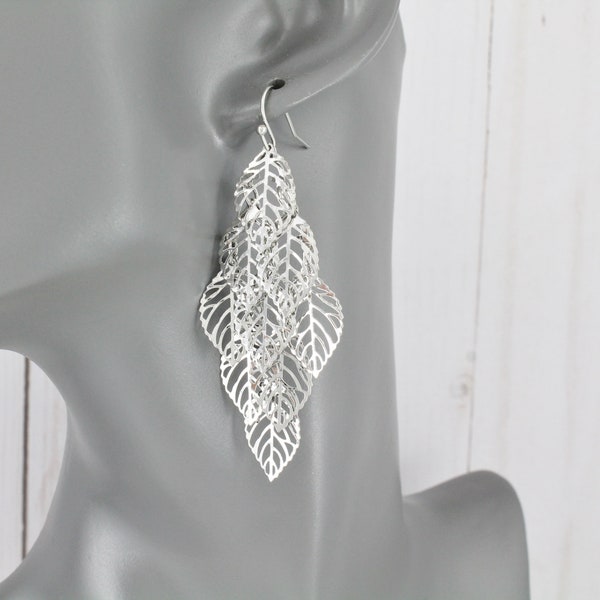 Silver chandelier earrings filigree leaf leaves earrings dangle cut out pattern lightweight 2 7/8" long shiny silver leaves