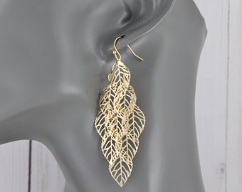 Gold chandelier earrings filigree leaf leaves earrings dangle cut out pattern lightweight 2 7/8" long shiny gold leaves