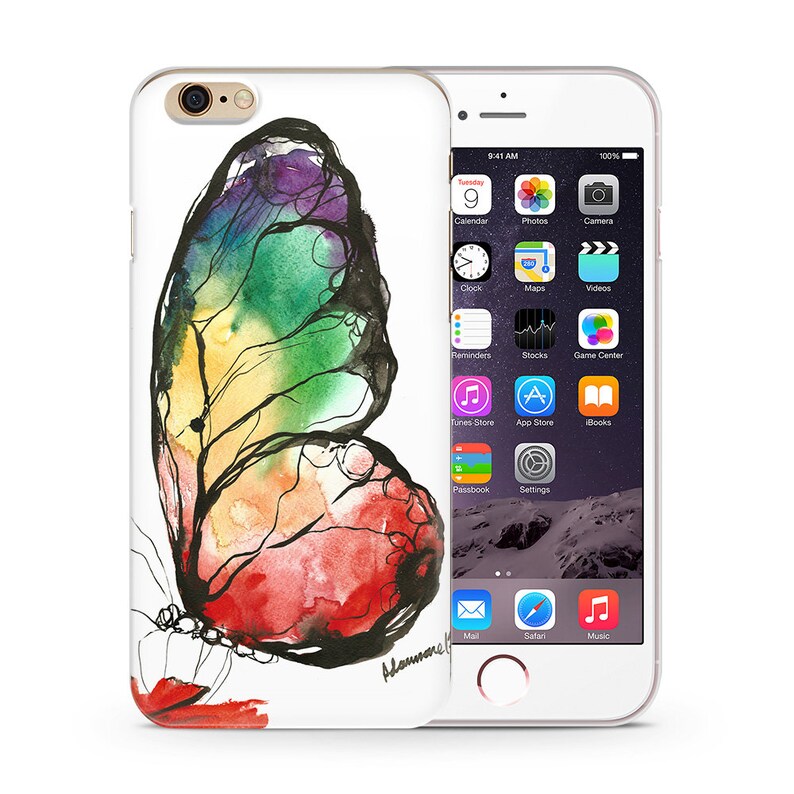 May include: A white iPhone case with a colorful watercolor butterfly design. The butterfly is painted in shades of red, orange, yellow, green, blue, and purple. The case has a white background and the butterfly is centered on the case. The case is designed for an iPhone 6 or 6s.