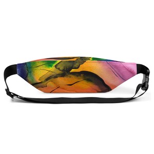 May include: A black fanny pack with an adjustable strap. The pack features a colourful abstract design with shades of blue, green, yellow, orange, and pink.