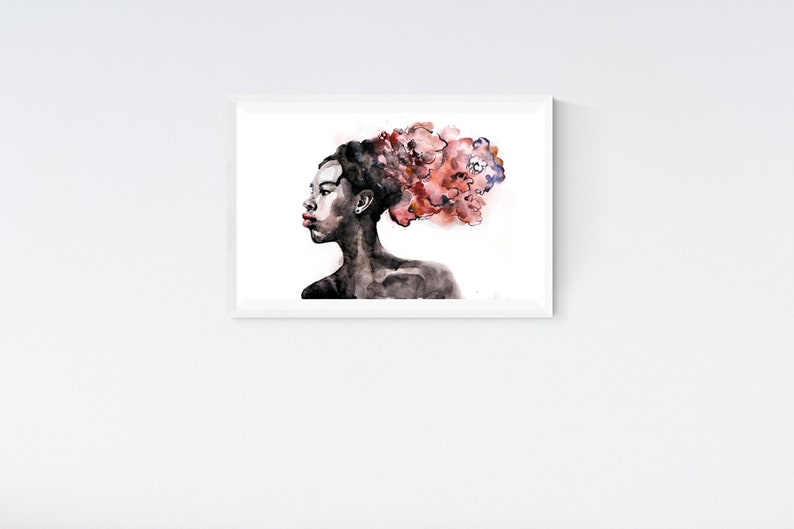 May include: A watercolor painting of a person with a dark complexion. The person has a red and pink flower-like design in their hair. The painting is in a white frame.