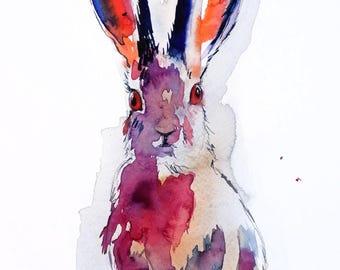 May include: Watercolor painting of a rabbit with red eyes and colorful ears. The rabbit's fur is white with splashes of purple, red, and orange. The artwork is on a white background, showcasing the vibrant colors of the animal.