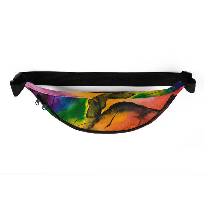 May include: A colourful fanny pack with a rainbow watercolour design. The pack has a black adjustable strap and a zipper closure.