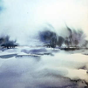 May include: Watercolour painting of a misty landscape in shades of blue and grey. The artwork depicts a body of water reflecting a hazy sky and distant trees. The artist's signature is in the bottom right corner.