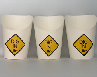 May include: Three white paper cups with a yellow diamond-shaped design that says "DIG IN" with a black silhouette of a bulldozer.