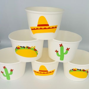 May include: Six white paper cups with different Mexican-themed designs. The designs include a sombrero, a cactus, and a taco.