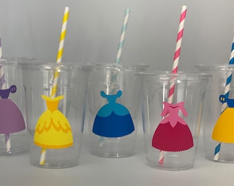May include: Five clear plastic cups with colorful princess dress designs and matching striped straws. The dresses are purple, yellow, blue, pink, and yellow.