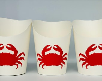May include: Three white paper cups with red crab silhouettes printed on the front. The cups are designed for serving food.