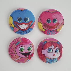 May include: Four round buttons featuring cartoon characters. The first button depicts a blue character with a wide smile and large eyes. The second button depicts a pink character with a wide smile and large eyes. The third button depicts a pink character with a wide smile and large eyes. The fourth button depicts a pink character with a wide smile and large eyes.