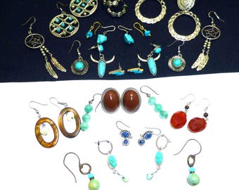 May include: A selection of earrings in various styles, including hoops, dangles, and studs. The earrings showcase diverse designs, such as turquoise, metal filigree, and beaded details. Colours include silver, gold, turquoise, brown, and red.