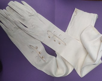 Unworn early 20th Century doeskin over the elbow full length gloves with ebony glove stretchers  size 6 1/4 to 6.5