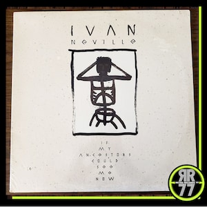 May include: A white vinyl record album cover with a black and white illustration of a skeleton figure. The album is titled "If My Ancestors Could See Me Now" by Ivan Neville.
