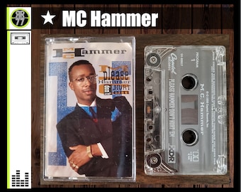 May include: A clear plastic cassette tape case with a black and white label. The label features a photo of MC Hammer and the text "Please Hammer Don't Hurt 'Em".