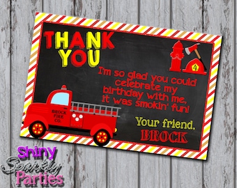 May include: Red and yellow thank you card with a black chalkboard background. The card features a red fire truck with the words "Brock Fire Co." on the side. The text on the card reads "Thank You. I'm so glad you could celebrate my birthday with me, it was smokin' fun! Your friend, Brock."
