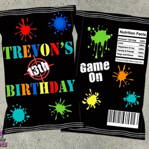 May include: Black and white chip bag with a target and the text "TREVON'S 13th BIRTHDAY" in rainbow colors. The back of the bag has the text "Game On" and a nutrition facts label with the text "Love, Happiness & Joy, Family & Friends, Hugs and Kisses" all with 100% daily value.