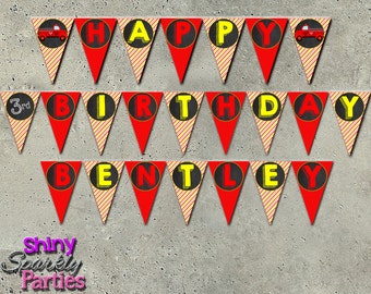 May include: Red and yellow triangle pennant banner with the words "Happy 3rd Birthday Bentley" in black circles. Each triangle has a red and yellow striped pattern. The banner is decorated with small red fire trucks.