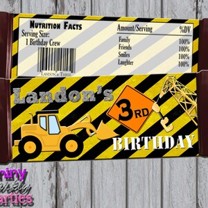 May include: A yellow and black construction-themed birthday party favor wrapper with a cartoon excavator and the text "Landon's 3rd Birthday".