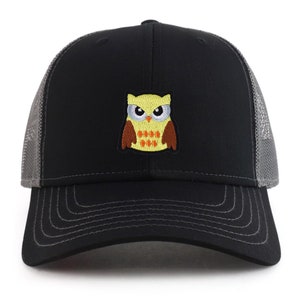 May include: Black and grey trucker hat with an embroidered yellow owl with orange eyes and beak. The owl has a brown body and orange feet.