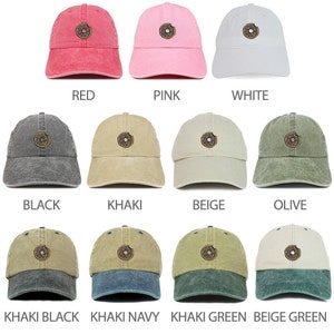 May include: A collection of 10 baseball caps with a donut graphic. The caps are in various colors, including red, pink, white, black, khaki, beige, olive, khaki black, khaki navy, khaki green, and beige green.