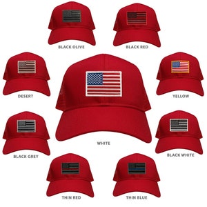 May include: Ten different trucker hats with a red mesh back and a red front panel. Each hat features a different embroidered American flag patch in various colours, including black, white, grey, olive, red, yellow, and desert.