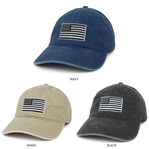 May include: Three baseball caps with an American flag patch on the front. The caps are in navy, khaki, and black.