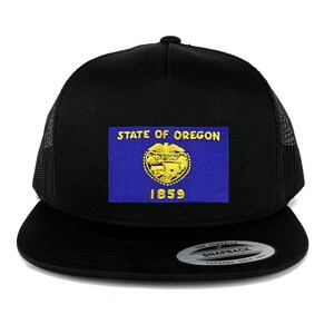 May include: A black trucker hat with a mesh back. The front of the hat features a yellow embroidered patch with the State of Oregon flag and the year 1859.