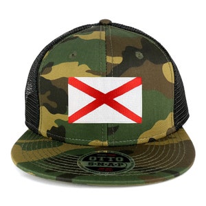 May include: A camouflage trucker hat with a black mesh back and a red and white Alabama state flag patch on the front. The hat has a snap closure and the words "Otto S-N-A-P" are printed on the back.